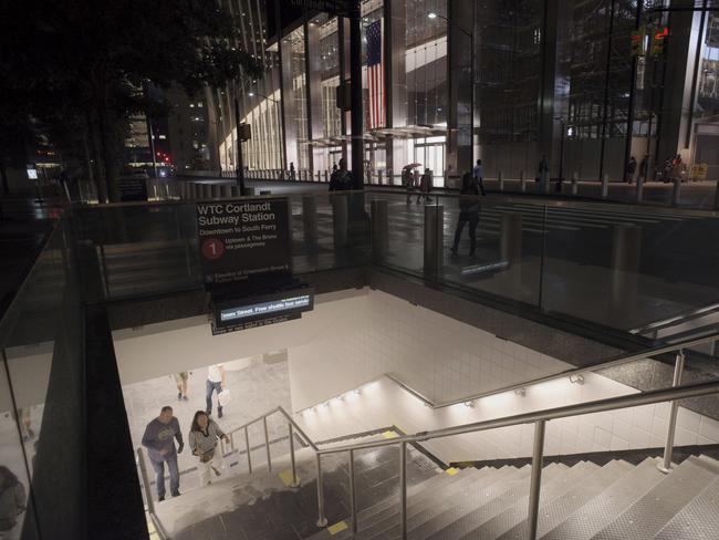 People walk up a flight of stairs in the World Trade Center complex from the newly-opened WTC Cortlandt subway station in New York. Picture: AP