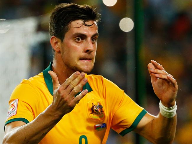 SYDNEY, AUSTRALIA - JANUARY 13: Tomi Juric of Australia reacts after missing an opportunity during the 2015 Asian Cup match between Oman and Australia at ANZ Stadium on January 13, 2015 in Sydney, Australia. (Photo by Daniel Munoz/Getty Images)