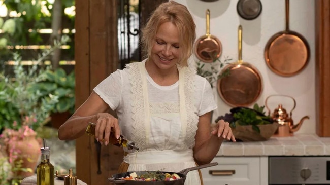 Pamela Anderson in the kitchen for her plant-based lifestyle show, Pamela’s Cooking With Love. Picture: Binge