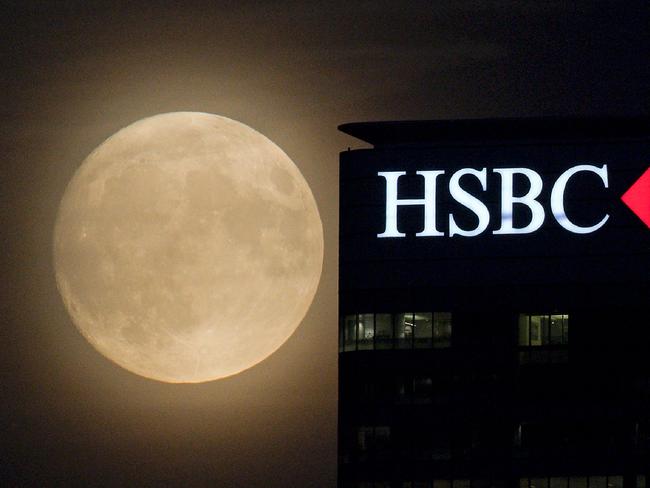 The moon rises behind HSBC back in London’s Docklands on November 13, 2016. Tomorrow, the moon will orbit closer to the earth than at any time since 1948, named a ‘supermoon’, it is defined by a Full or New moon coinciding with the moon’s closest approach to the Earth. Picture: AFP PHOTO / JUSTIN TALLIS