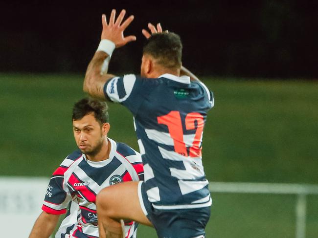 Casuarina’s Simaika Salaa attempts a charge-down. Picture GLENN CAMPBELL