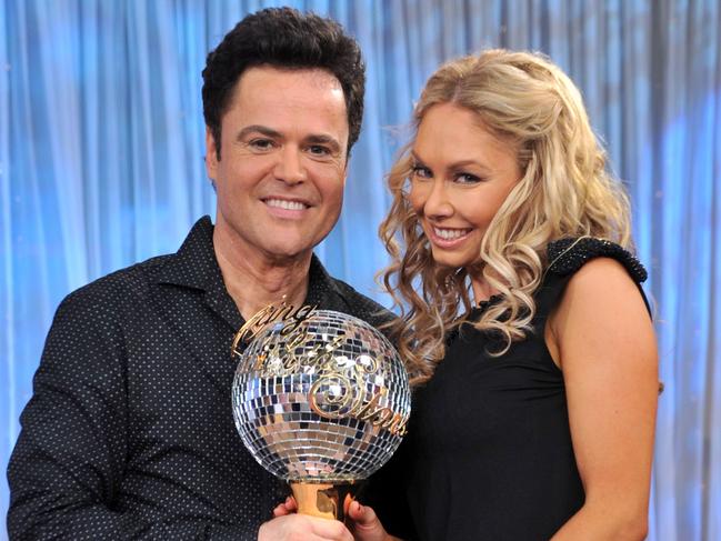 Entertainer Donny Osmond and Kym Johnson with the US 'Dancing With The Stars trophy in 2009.