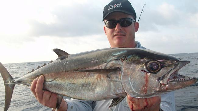 Anthony Sicuto with a little dogtooth tuna caught during a trip wide of Darwin with Arafura Bluewater Charters. Picture: Arafura Bluewater Charters