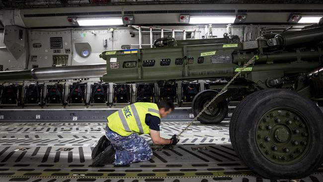 RAAF No. 23 Squadron load a M777 155mm lightweight towed howitzer bound for Ukraine onto a C-17A Globemaster III aircraft at RAAF Base Amberley in Queensland. Picture: Defence