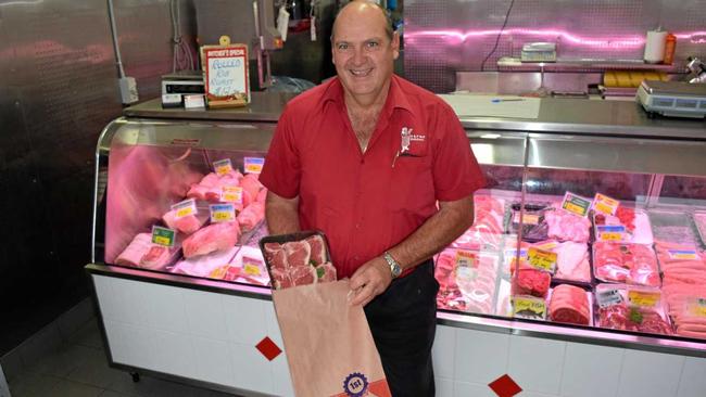 NO CHARGE: Ross Bell of Bell Butchers gives out paper bags for free in the wake of the plastic bag ban. Picture: Elyse Wurm