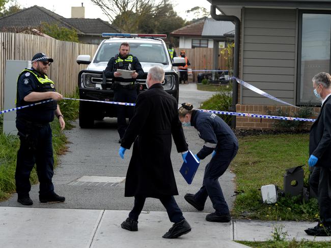 Police at the scene where four people were found dead. Picture: Andrew Henshaw