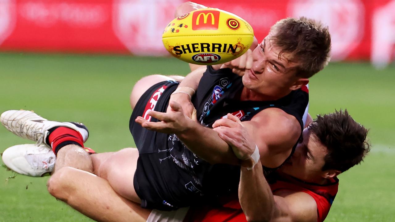 Jake Kelly brings down Ollie Wines. Picture: James Elsby/AFL Photos via Getty Images