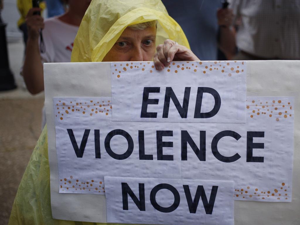 Protester Cathy Ward holds a sign while demonstrating outside the office of Senate Majority Leader Mitch McConnell. Picture: Getty