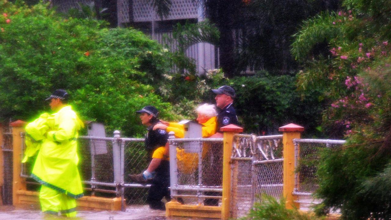 Police rescue an elderly man from his home in Railway Estate. Picture: Zak Simmonds