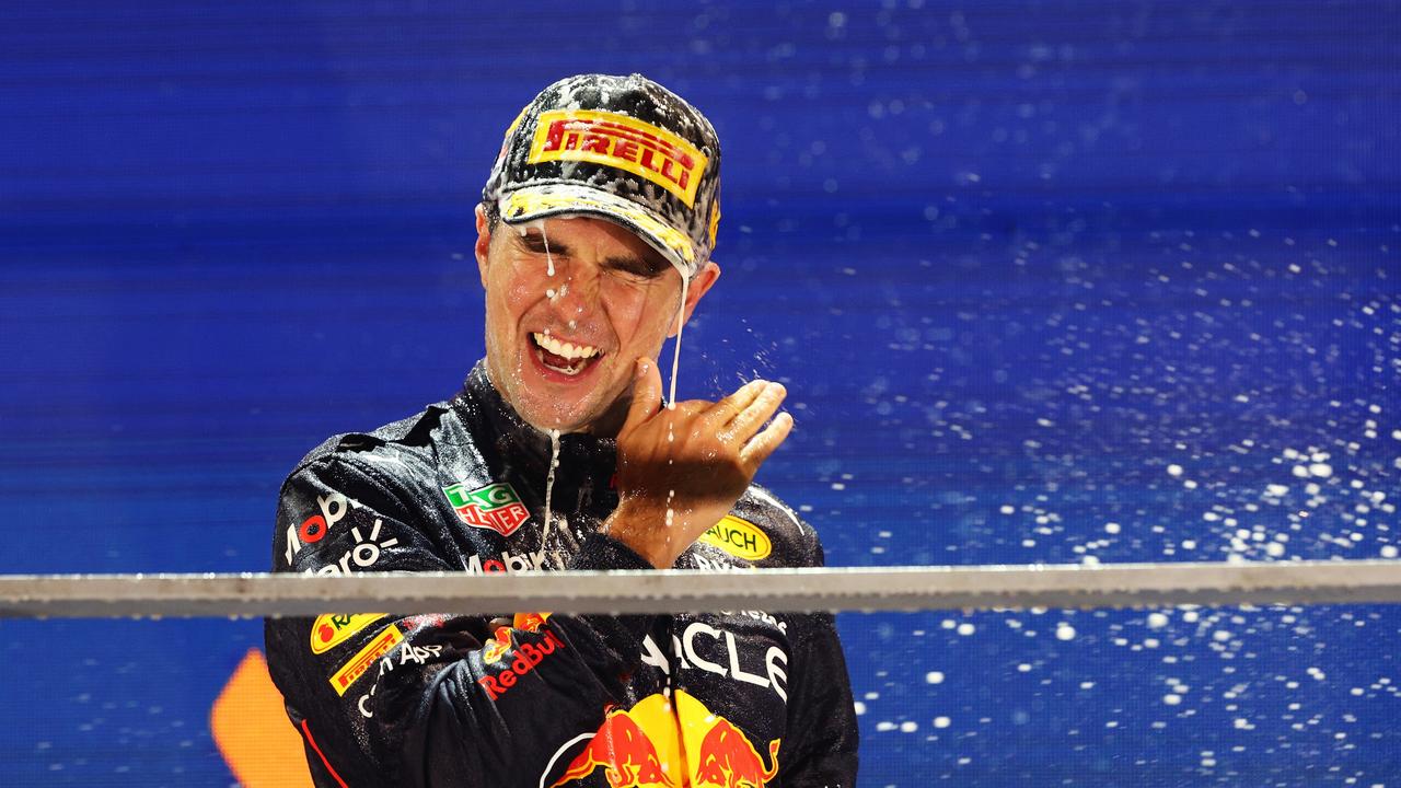 Sergio Perez of Mexico and Oracle Red Bull Racing celebrates on the podium