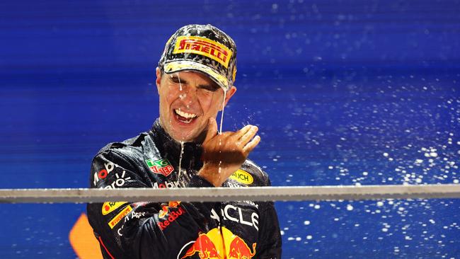 Sergio Perez of Mexico and Oracle Red Bull Racing celebrates on the podium