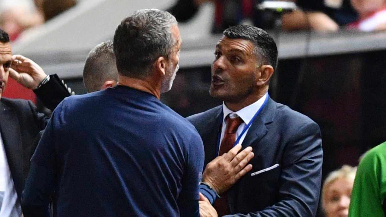 Marco Kurz and John Aloisi scuffle. (AAP Image/David Mariuz)