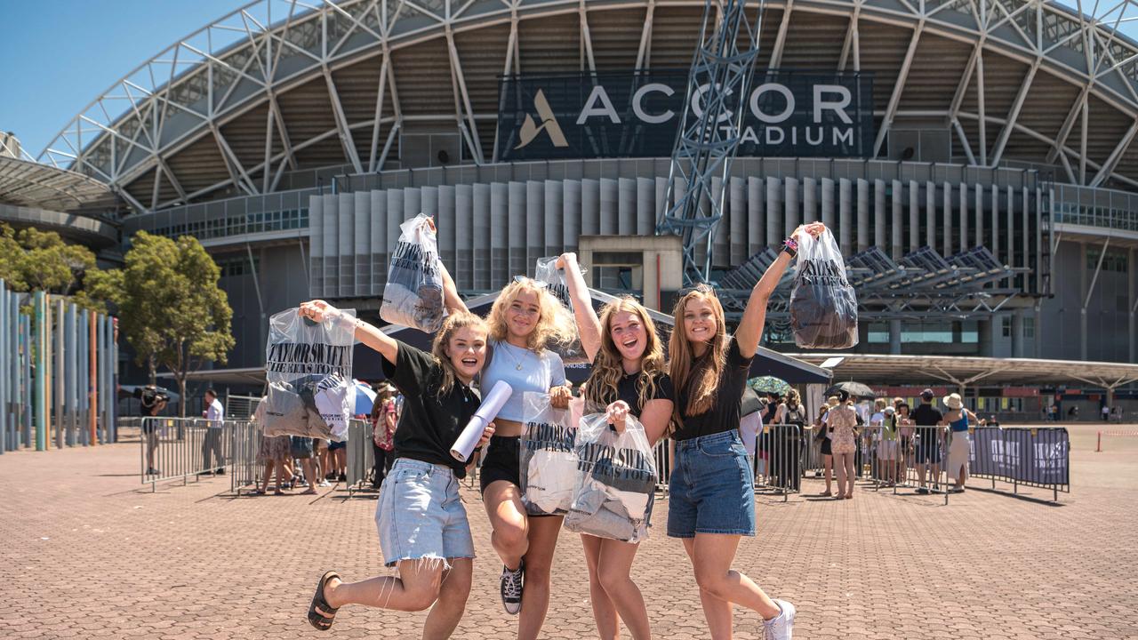 Taylor Swift fans Sarah Scherer, Hannah Scherer, Grace Scherer, Rachel Scherer managed to purchase some merchandise before it all sold out. Picture: NCA NewsWire / Flavio Brancaleone