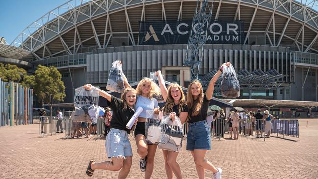 Taylor Swift fans Sarah Scherer, Hannah Scherer, Grace Scherer, Rachel Scherer managed to purchase some merchandise before it all sold out. Picture: NCA NewsWire / Flavio Brancaleone