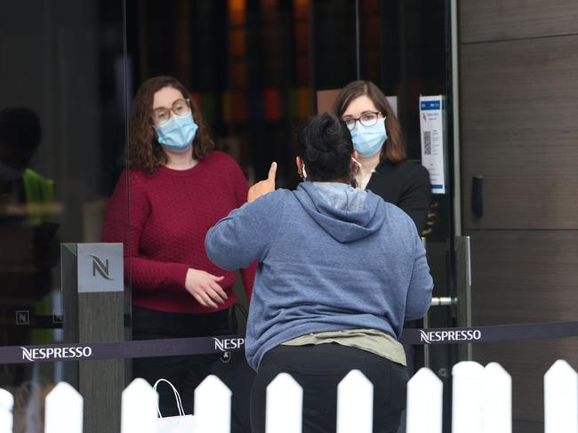 Some masked women speaking outside the Nespresso store in Rundle Mall. Picture: NCA NewsWire / David Mariuz