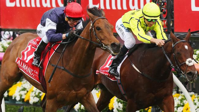 MELBOURNE, AUSTRALIA — NOVEMBER 01: Jockey Kerrin McEvoy (L) riding Almandin wins ahead of Jockey Joao Moreira on Heartbreak City in race 7 the Emirates Melbourne Cup on Melbourne Cup Day at Flemington Racecourse on November 1, 2016 in Melbourne, Australia. (Photo by Michael Dodge/Getty Images)