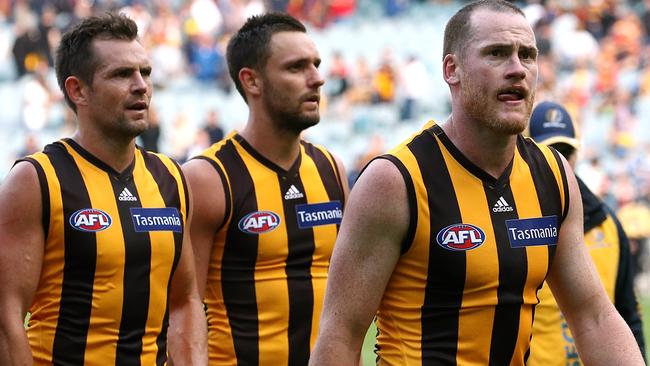 Jarryd Roughead, Luke Hodge and Jack Gunston leave the ground after Hawthorn’s loss. Picture: Wayne Ludbey