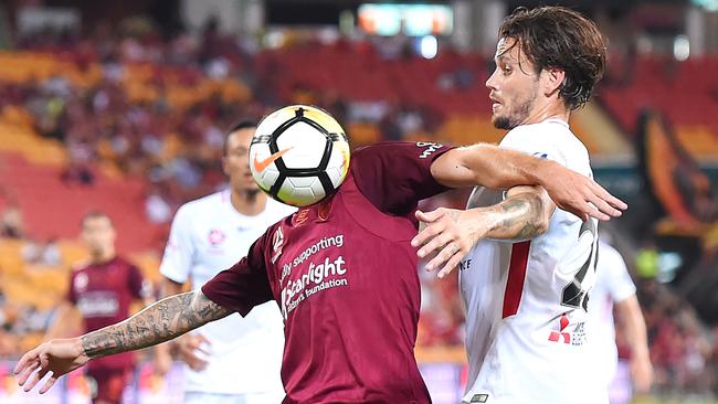 Brisbane Roar’s Corey Gameiro and Western Sydney’s Chris Herd compete for the ball at Suncorp Stadium Picture: AAP.
