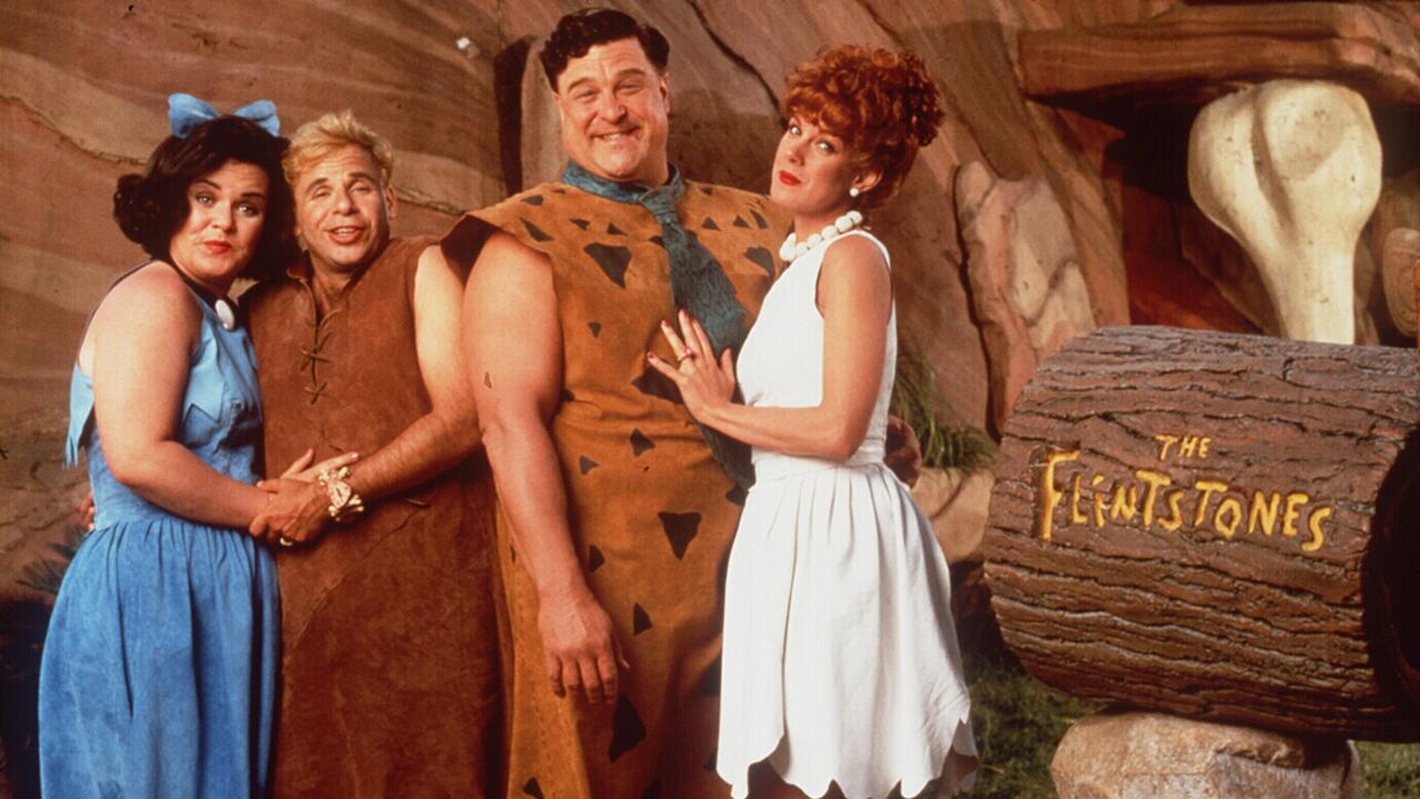 Goodman with Rosie O'Donnell, Rick Moranis and Elizabeth Perkins in 1994 film The Flintstones.