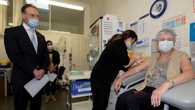 Health Minister Greg Hunt poses for photos with Anne Hyslop as she receives her COVID vaccine. Picture: NCA NewsWire/Andrew Henshaw