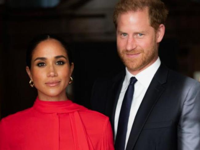 Harry with his wife, Meghan Markle.