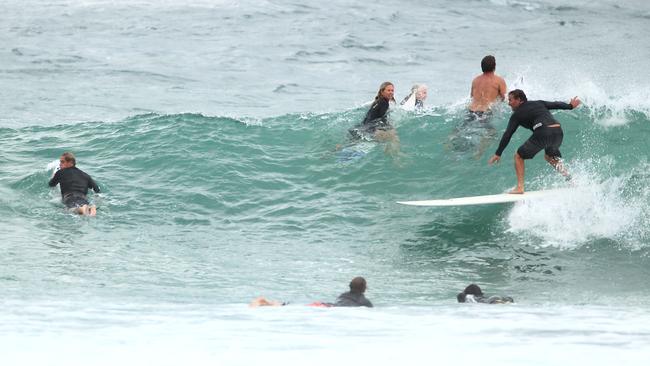 Surf's up, wind's up and, crowd numbers are up at Snapper Rocks. Picture: Scott Fletcher