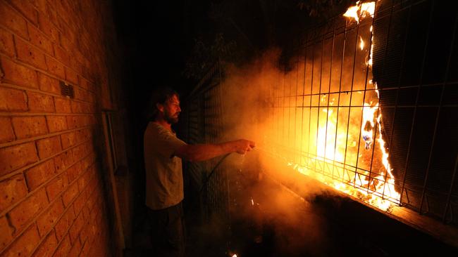 Tathra resident Julian Brown fights the fire in 2018. Picture: Gary Ramage