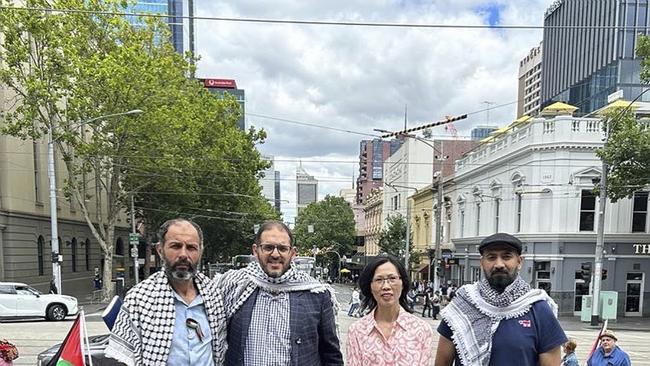 Islamic Council of Victoria president Adel Salman and Victorian Multicultural Commission chair Vivienne Nguyen (centre) at the "sitintifada" being held by pro-Palestine protesters on the steps of Victorian Parliament in December.