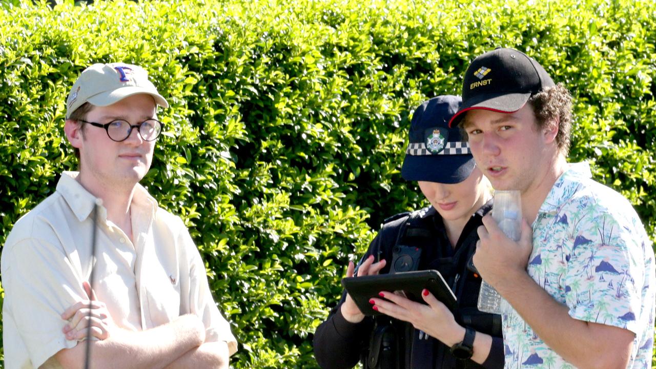 Police speak to witnesses at the scene of the fierce blaze. Picture: Steve Pohlner