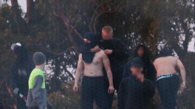 Inmates from the Frank Baxter Juvenile corrections centre Kariong taunt police from the roofs of various buildings. Picture: John Grainger