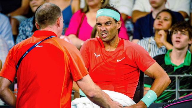 Nadal receives medical treatment for his hip at the Brisbane International. Picture: AFP