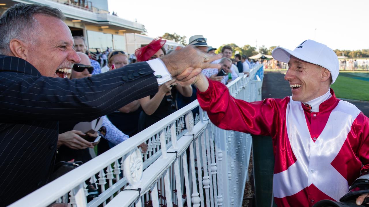 William Pike is congratulated by punters after riding Galaxy Star to victory. Picture: AAP