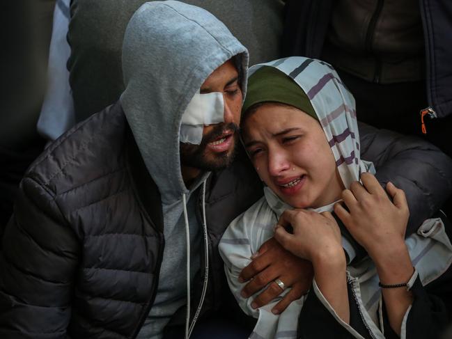 People mourn as they receive the dead bodies of victims of an Israeli strike in Rafah, Gaza. Picture: Getty Images