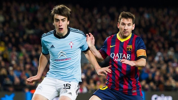 Adelaide Comets' Spanish recruit Jon Aurtenetxe playing for Celta Vigo against Barcelona legend Lionel Messi in 2014.