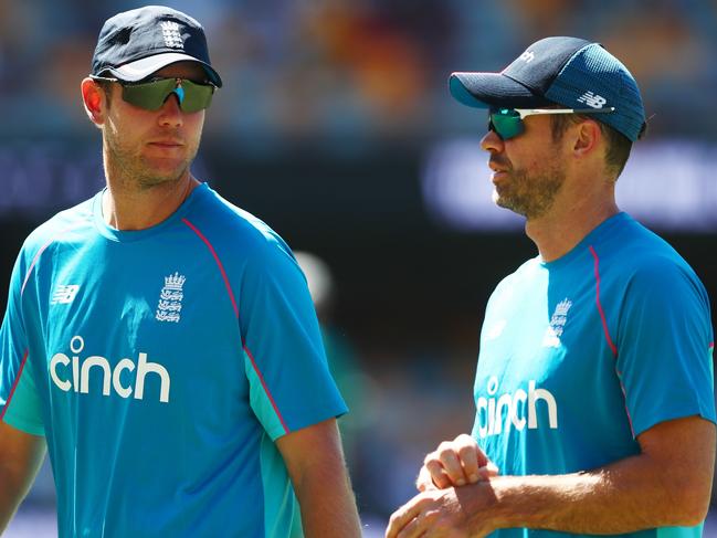 BRISBANE, AUSTRALIA - DECEMBER 11: Stuart Broad of England and James Anderson speak during warm up ahead of day four of the First Test Match in the Ashes series between Australia and England at The Gabba on December 11, 2021 in Brisbane, Australia. (Photo by Chris Hyde/Getty Images)