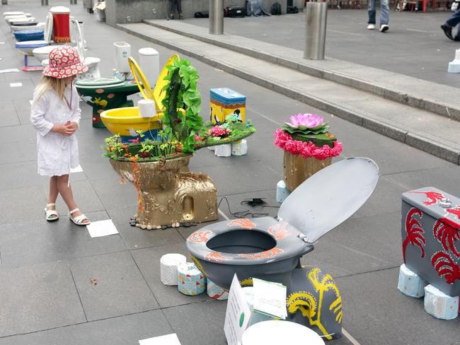 All cisterns go: World Toilet Day exhibition of toilets at the forecourt of Customs House at Circular Quay.