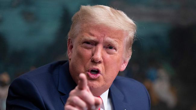 US President Donald Trump speaks to reporters after participating in a Thanksgiving teleconference with members of the United States Military, at the White House