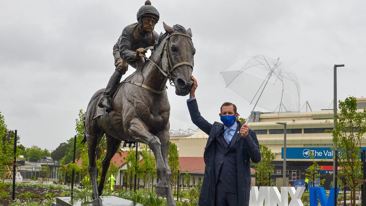 Hugh Bowman with the statue of Winx at the Valley. Picture: Racing Photos via Getty Images