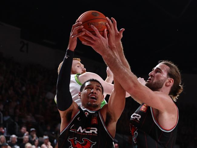 Trey Kell III and Sam Froling get up for a rebound. Picture: Getty Images