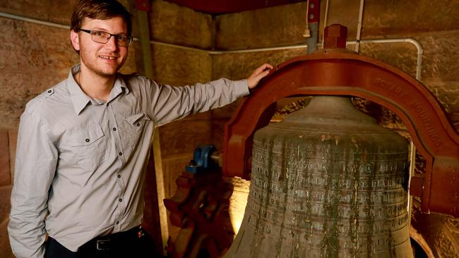 Thomas Perrins with the sole bell at St Patrick’s Parramatta. Picture: Angelo Velardo