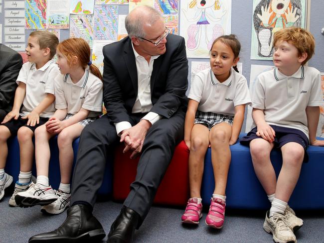 Prime Minister Scott Morrison with year 1 students from Galilee Catholic Primary School. Picture: Picture: Jonathan Ng