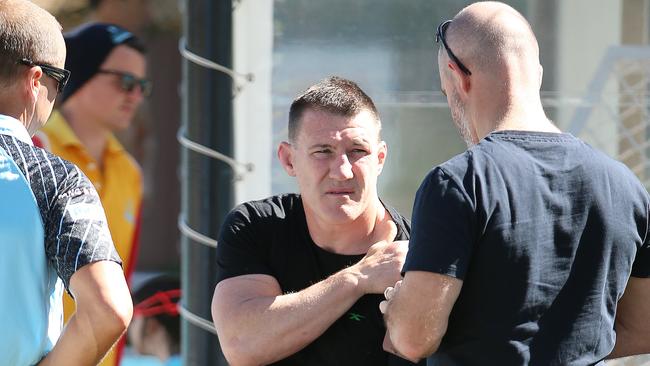 Paul Gallen chats with Cronulla officials as he nurses a sore shoulder at Sharks’ recovery on Saturday. Picture: Sam Ruttyn