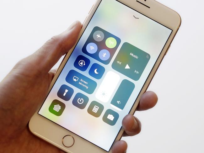 In this Sept. 15, 2017, photo, the iOS 11 control center is displayed on the iPhone 8 Plus in New York. The control center offers easy access to the flashlight and other tools with a swipe up from the bottom. It got separated into multiple pages last year to increase the options available, but the extra swipes got annoying. With iOS 11, itâ€™s back to a single page. (AP Photo/Mark Lennihan)