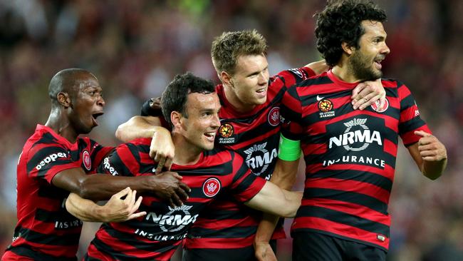 Wanderer's Mark Bridge , Nikolai Topor-Stanley and team mates celebrate he 2nd goal during the Aleague game between Sydney FC and Western Sydney Wanderers at Allianz Stadium,Moore Park .Picture Gregg Porteous