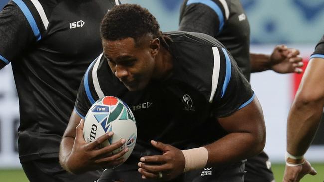 Fiji rugby team player Viliame Mata, 2nd from left, handles the ball during training at the Sapporo Dome before the start of the Rugby World Cup in Sapporo, Northern Japan, Friday, Sept. 20, 2019. Fiji will play against Australia on Saturday Sept. 21 in their first game. (AP Photo/Aaron Favila)