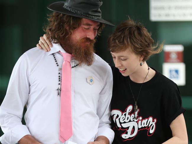 Emma Dorge meets Marcus Burke  in Hat who glued himself in the Mags court today. Pic Annette Dew