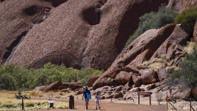 Tourists at Uluru National Park. Picture: Martin Ollman