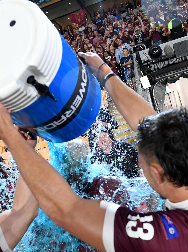 Wayne Bennett has an ice bucket poured on him by Tino Fa'asuamaleaui (Photo by Bradley Kanaris/Getty Images)