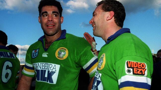 Captain Mal Meninga (L) is congratualted by teammate Ricky Stuart after his final match for the club following Canberra Raiders v Western Suburbs Winfield Cup game at Bruce Stadium in Canberra, 21/08/1994.