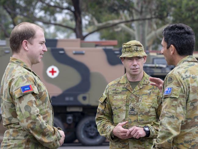 Australian Defence Force National Support Coordinator, Major General Justin Ellwood DSC (right), with Captain Brain Collis (left) and Warrant Office Class 2 Shannon Dorahy from 4th Combat Service Support Battalion at RAAF Base East Sale during Operation Bushfire Assist.